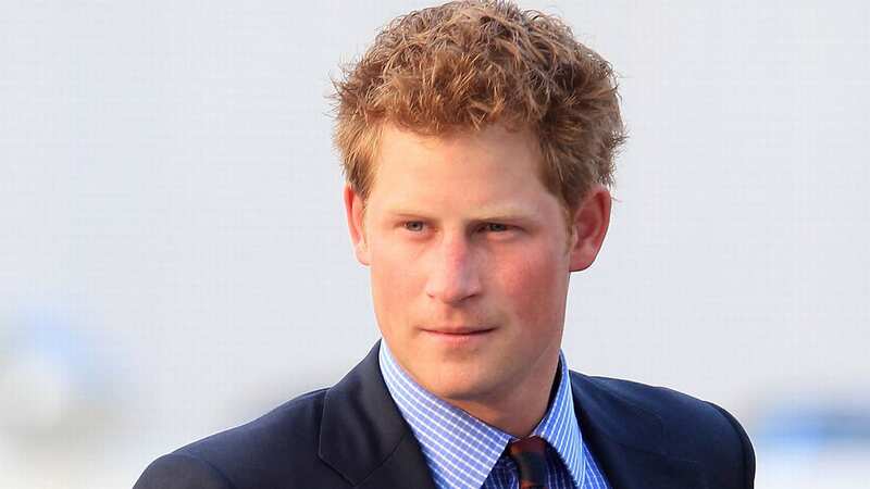 Prince Harry shared a passionate kiss with model Suzzannah Harvey at the Beaufort Hunt Christmas Ball (Image: Getty Images)