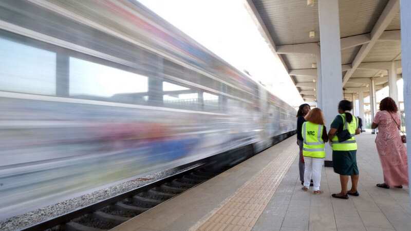 Nigerian Railway Corporation personnel on a platform in Abujas, Nigeria in December (Image: AFP via Getty Images)