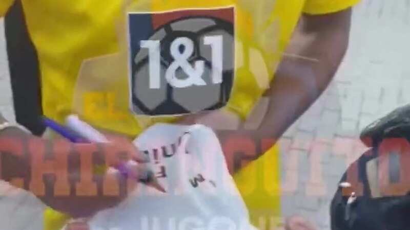 Jude Bellingham signs Real Madrid shirt as he