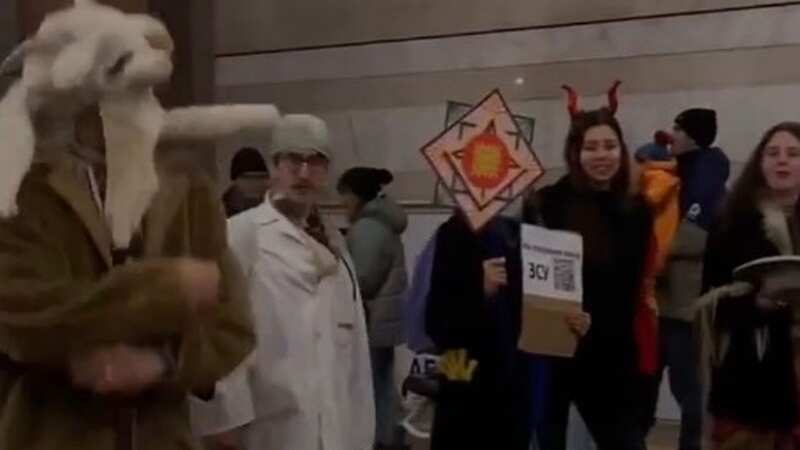 Defiant Ukrainians sing and dance as Russians launch new attack on train station
