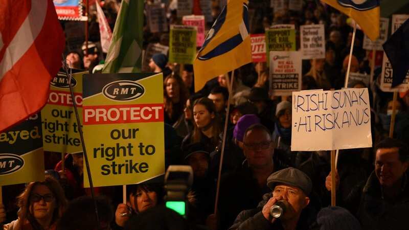Demonstrators outside Downing Street protest controversial anti-strike legislation (Image: AFP via Getty Images)