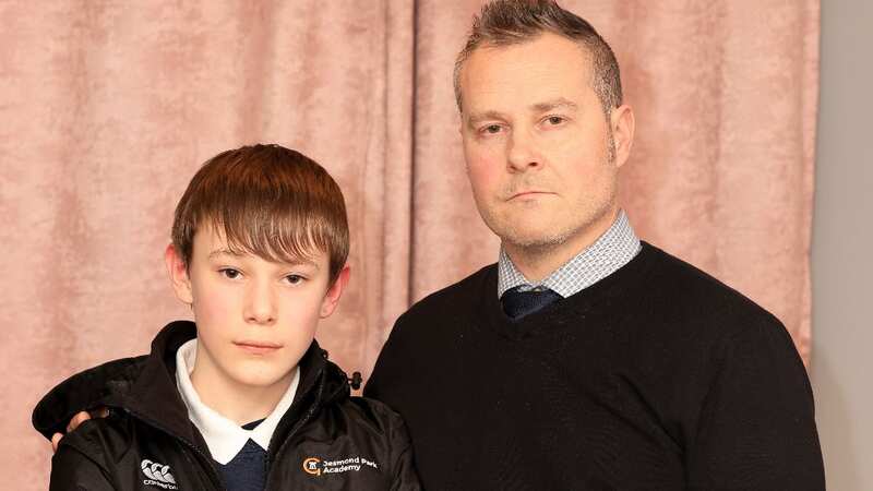 Aaron Bailey with his son Levon, 12, wearing the school