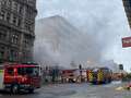 Huge blaze at iconic city building as smoke fills street and crews rush to scene