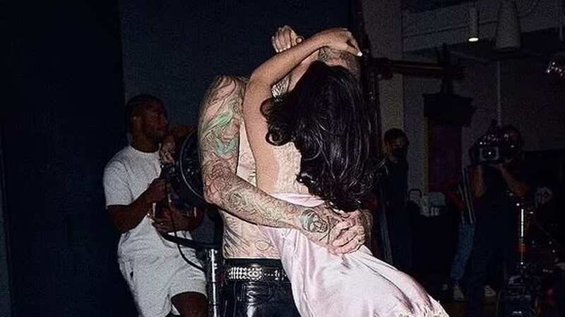 Kourtney Kardashian flashes bum as Travis lifts silky nightie in risqué shots