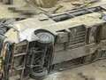 Tour bus carrying over 60 people plunges off 'curve of death' cliff killing 23