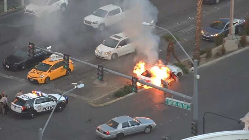 Unconscious man rescued from burning car before it bursts into flames