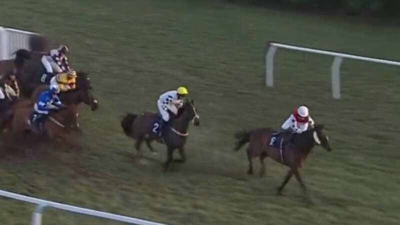 Heidi Palin (right) has both legs on one side of the horse but manages to recover and win the race (Image: Sky Sports)
