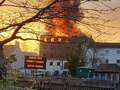 Huge warehouse fire shuts down busy town centre as firefighters battle blaze