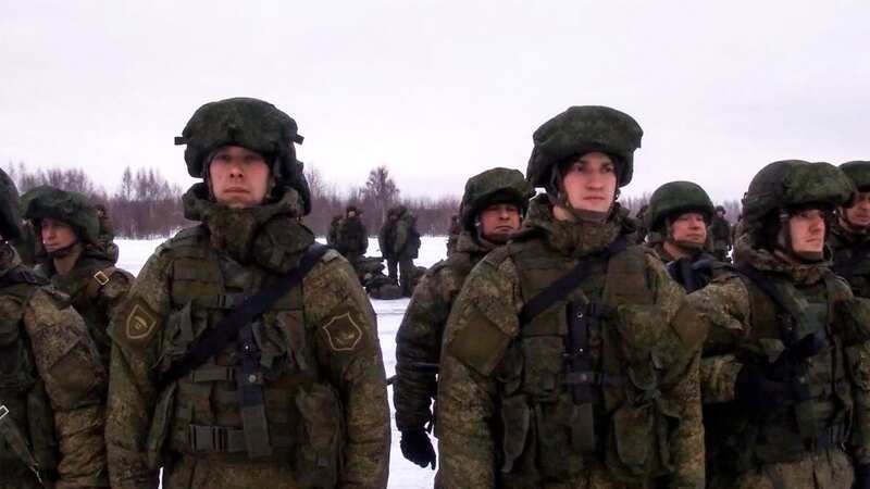 Russian paratroopers lining up to board a military cargo plane (Image: Russian Defence Ministry/AFP via)