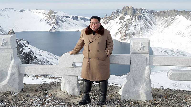 Kim Jong-un on Mount Paektu - where his father Kim Jong-Il was said to have been born (Image: Credit: Pen News)