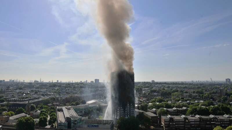 The firefighter is claimed to have taken a selfie in front of the smouldering tower (Image: PA)