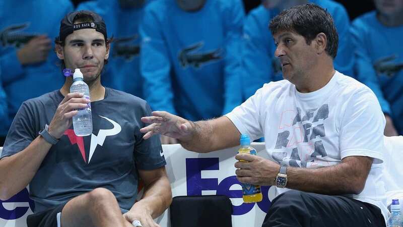 Rafael Nadal preparing to play a shot as he is watched by Toni Nadal at the Australian Open in 2012 (Image: Getty)