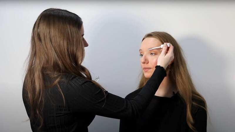 Deirbhile applying clear brow gel to Courtney (Image: Courtney Pochin/ Daily Mirror)