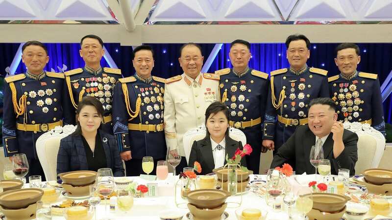 Kim Ju-ae sat in the middle alongside her mum Ri Sol-ju and Kim Jong-un (Image: KCNA VIA KNS/AFP via Getty Image)