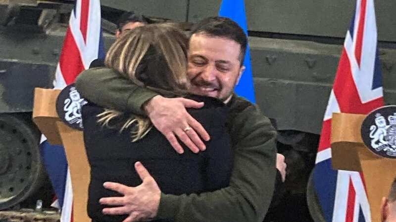 Moment President Zelensky snubs security rules to give Ukrainian reporter a hug
