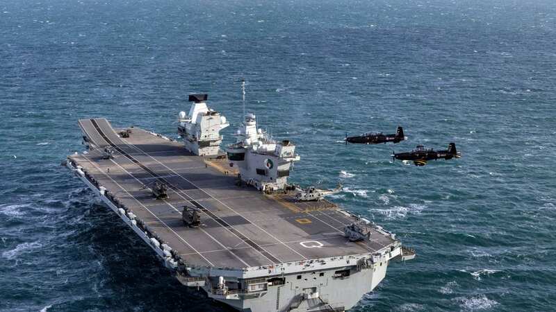 Royal Navy aircraft carrier chases away Chinese spy submarine