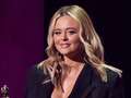 Emily Atack almost suffers BRITs wardrobe mishap as she makes 'single' joke