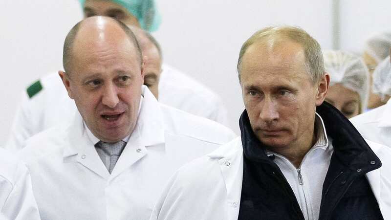 Businessman Yevgeny Prigozhin, left, shows Russian President Vladimir Putin, around his factory (Image: Alexei Druzhinin/AP/REX/Shutterstock)