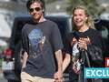 Louis Tomlinson holds hands with mystery blonde months after split from ex dqxikeidqkikdinv