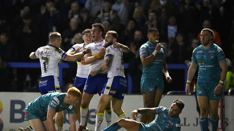 Daryl Clark of Warrington celebrates scoring his team