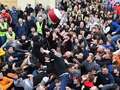Chaos as dozens kick each other in 'medieval football game' outside William Hill dqxikeidqkikdinv