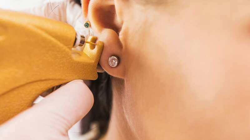 The girl, 11, returned home with several new ear piercings (stock photo) (Image: Getty Images/iStockphoto)