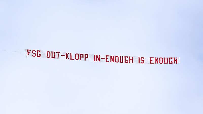 The banner could be seen aboove the ground before the match (Image: PA)
