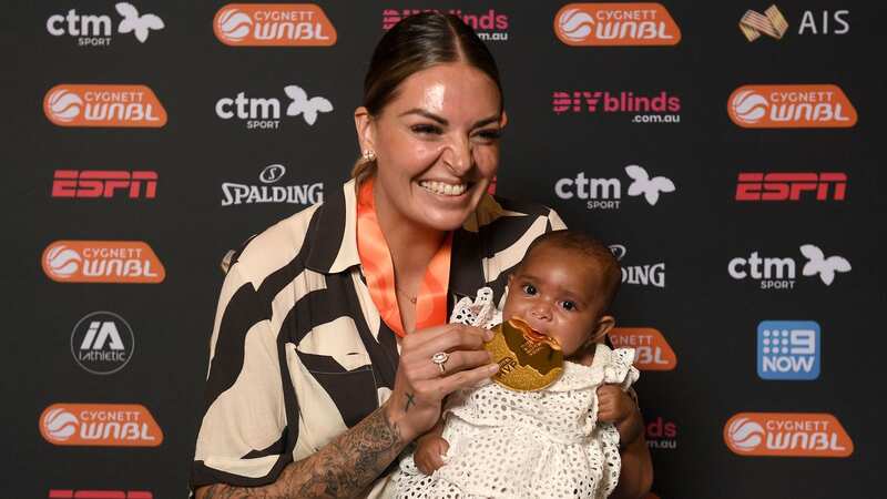 Cayla George celebrates being named WNBL MVP with her baby daughter Pearl (Image: Morgan Hancock/Getty Images)
