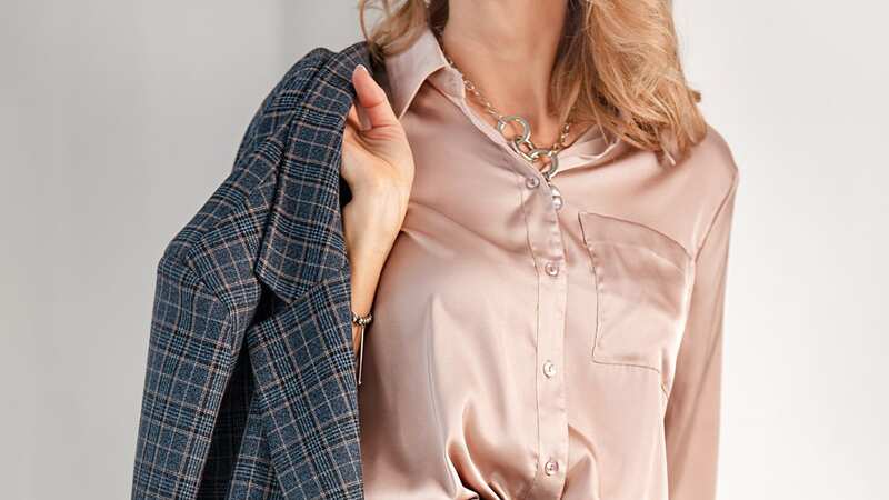 Satin shirts and oversized sunglasses are back on the fashion scene (Image: Getty Images/iStockphoto)