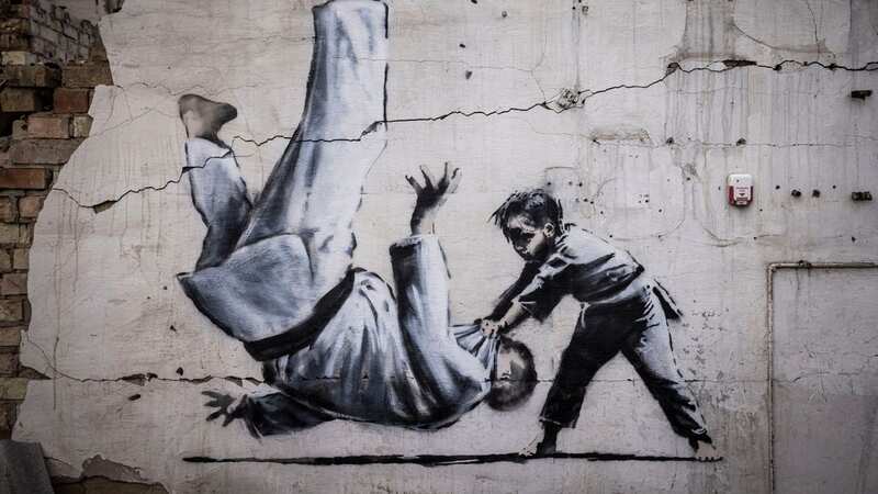 The stamps show a Banksy creation of Russian president Vladimir Putin being flipped by young boy during a judo match (Image: AP)