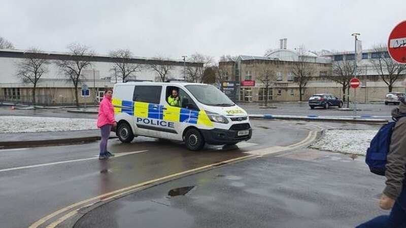 Police vehicles outside the leisure centre in Cheltenham (Image: BPM MEDIA)