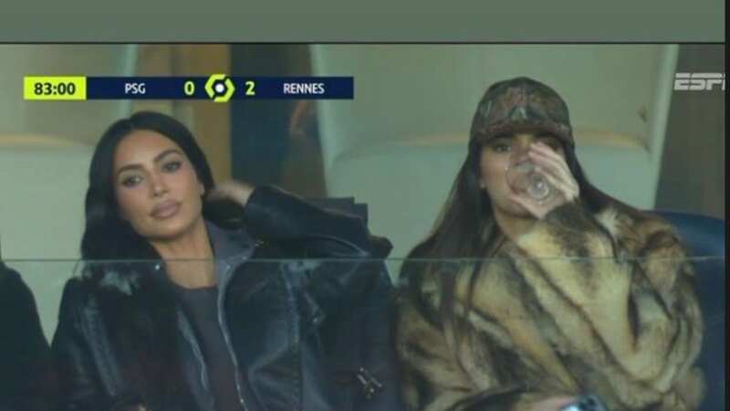Kim Kardashian and Kendall Jenner sip wine at PSG after getting personalised messages from stars (Image: AFP via Getty Images)