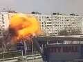 Moment Russian rocket flies past Ukrainian shopping mall and explodes into flats dqxikeidqkikdinv