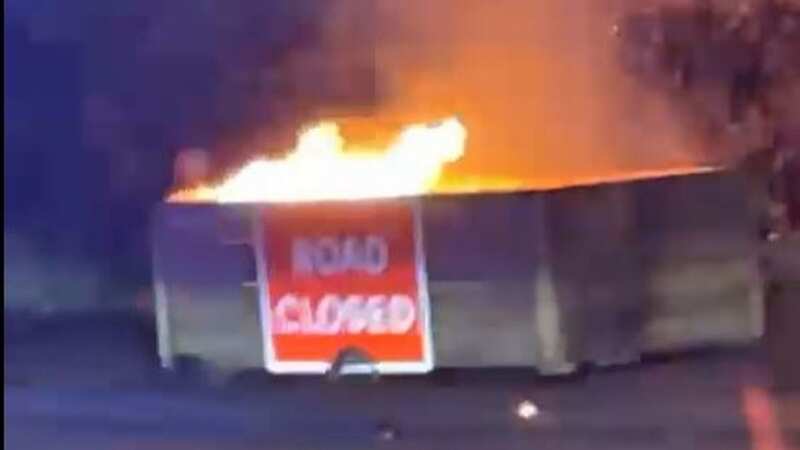 The road blocks were set alight, hours after the scheme was launched (Image: MEN MEDIA)