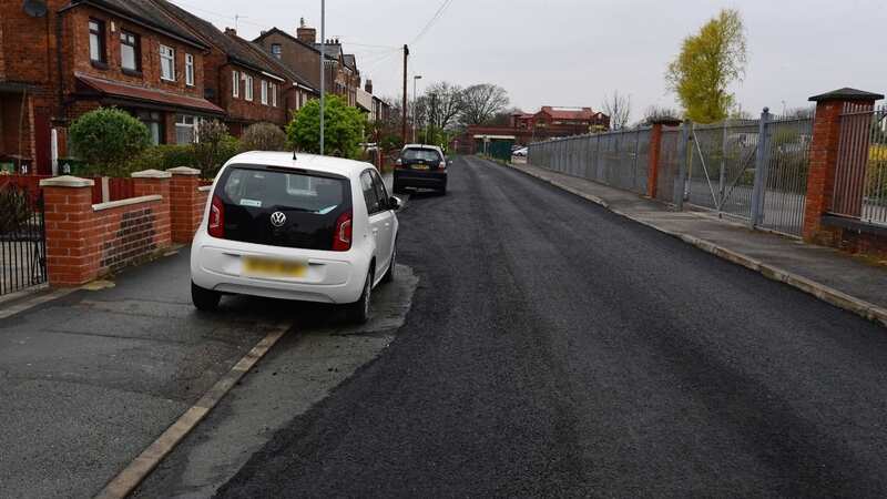 The road was completely resurfaced, with just a small section around a white Volkswagen Up left bare (Image: Liverpool ECHO)