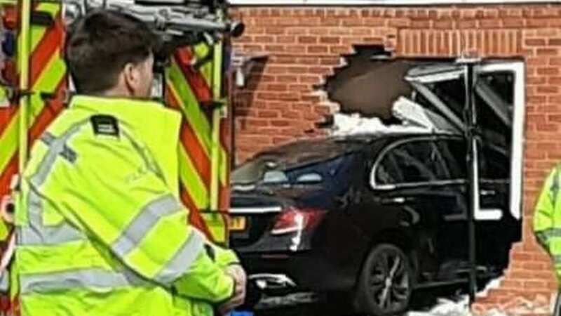 The black Mercedes was seen embedded deep in the wall of the property (Image: Supplied)