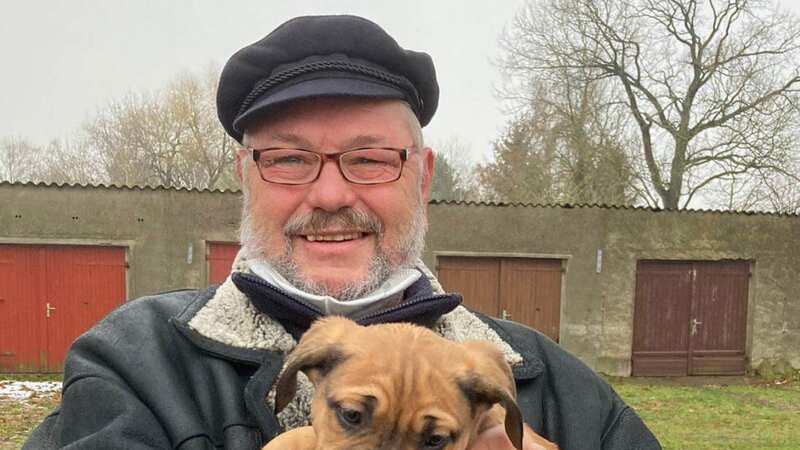 Lothar B., 62, with his dog Benno who both died after re-entering the burning building (Image: Newsflash)