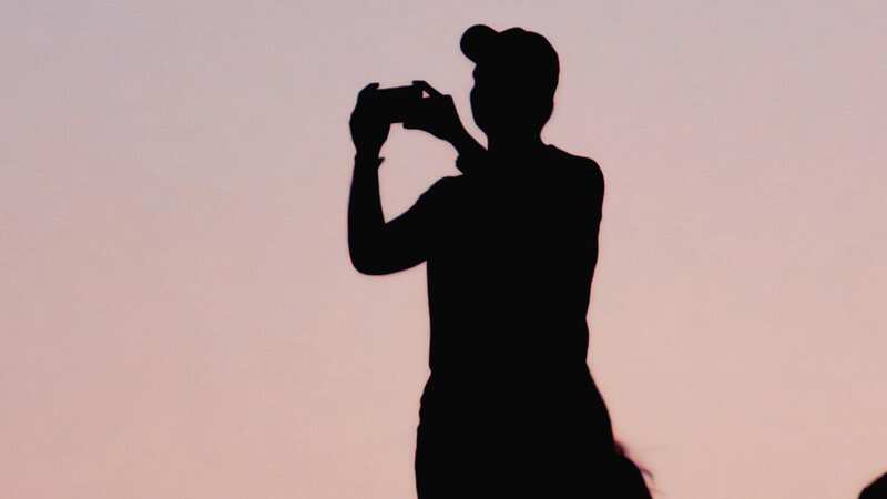 Which direction is the man facing?