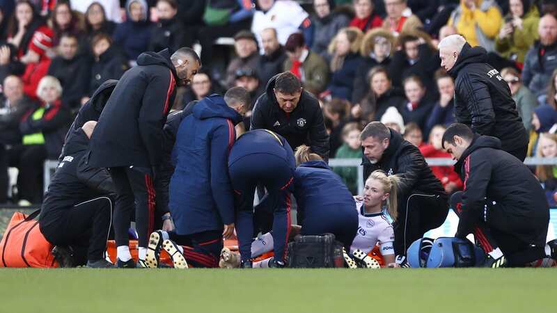 Leah Williamson receives medical treatment during the WSL clash against Manchester United (Image: Photo by Naomi Baker/Getty Images)