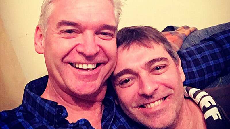 Timothy Schofield (right) with TV presenter and brother Phillip, has been dismissed from Avon & Somerset Police (Image: Internet Unknown)