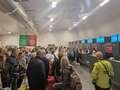 Holidaymakers miss flights as IT chaos sees airport screens tell them to 'relax'