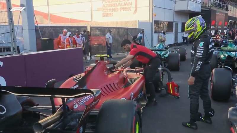 Lewis Hamilton was taking a close look at the Ferrari car (Image: Sky Sports)
