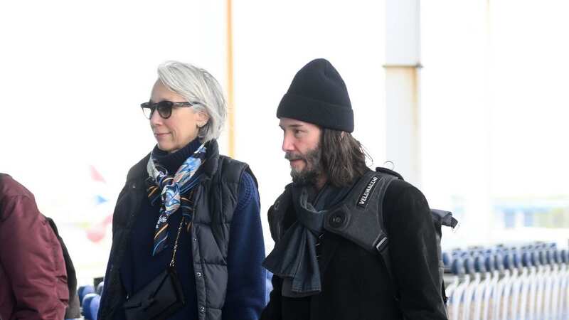 Smitten Keanu Reeves holds girlfriend