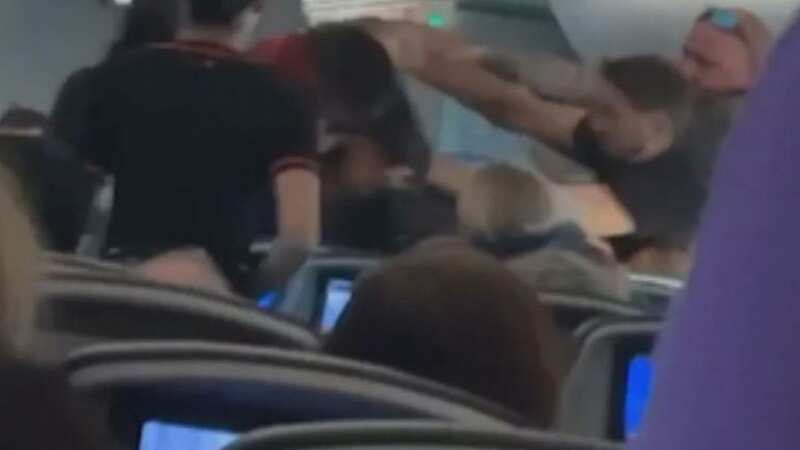 Three passengers were escorted by police from a plane for causing chaos (Image: 9News)