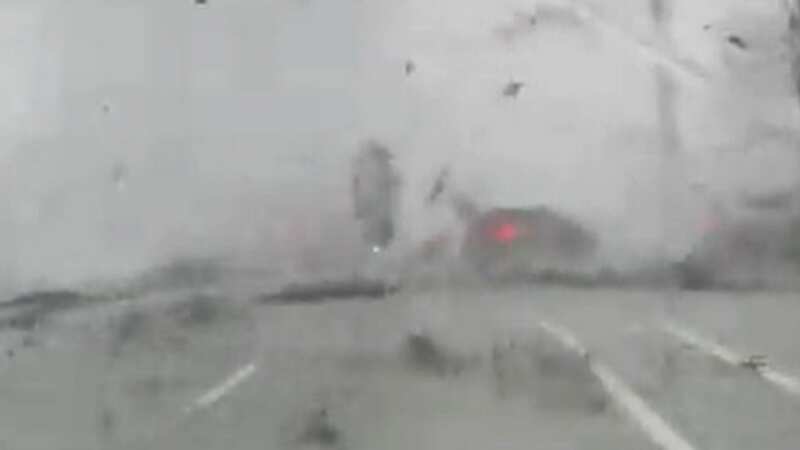 The force of the tornado lifted a car off the ground and across the road (Image: Michael/cbs12)