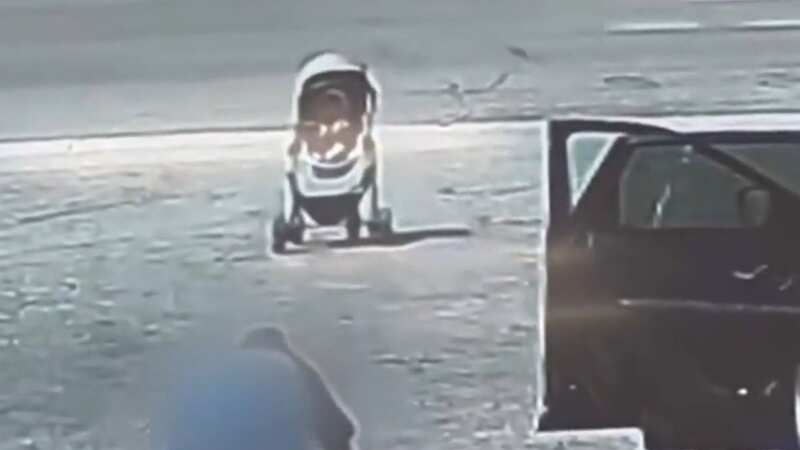 Terrifying moment a pram with baby boy inside rolls towards speeding traffic