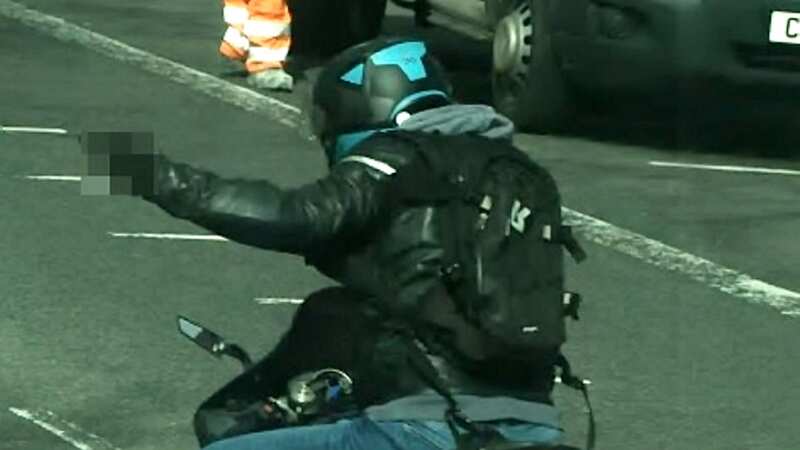 The motorbike rider was caught making a rude gesture several times (Image: Kent Police / SWNS)