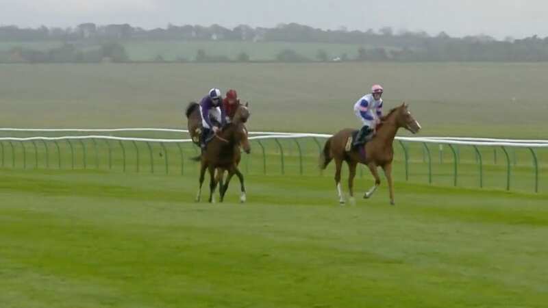 Tom Marquand (red colours) receives a kick from another horse (Image: ITV)