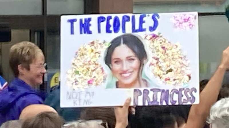 Royal protestors hold Meghan Markle 