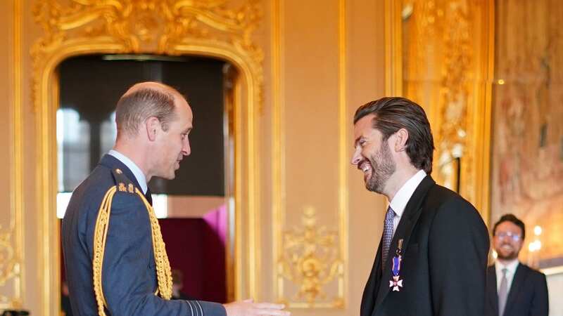 Jason Knauf receives an award from Prince William at Windsor Castle today (Image: PA)